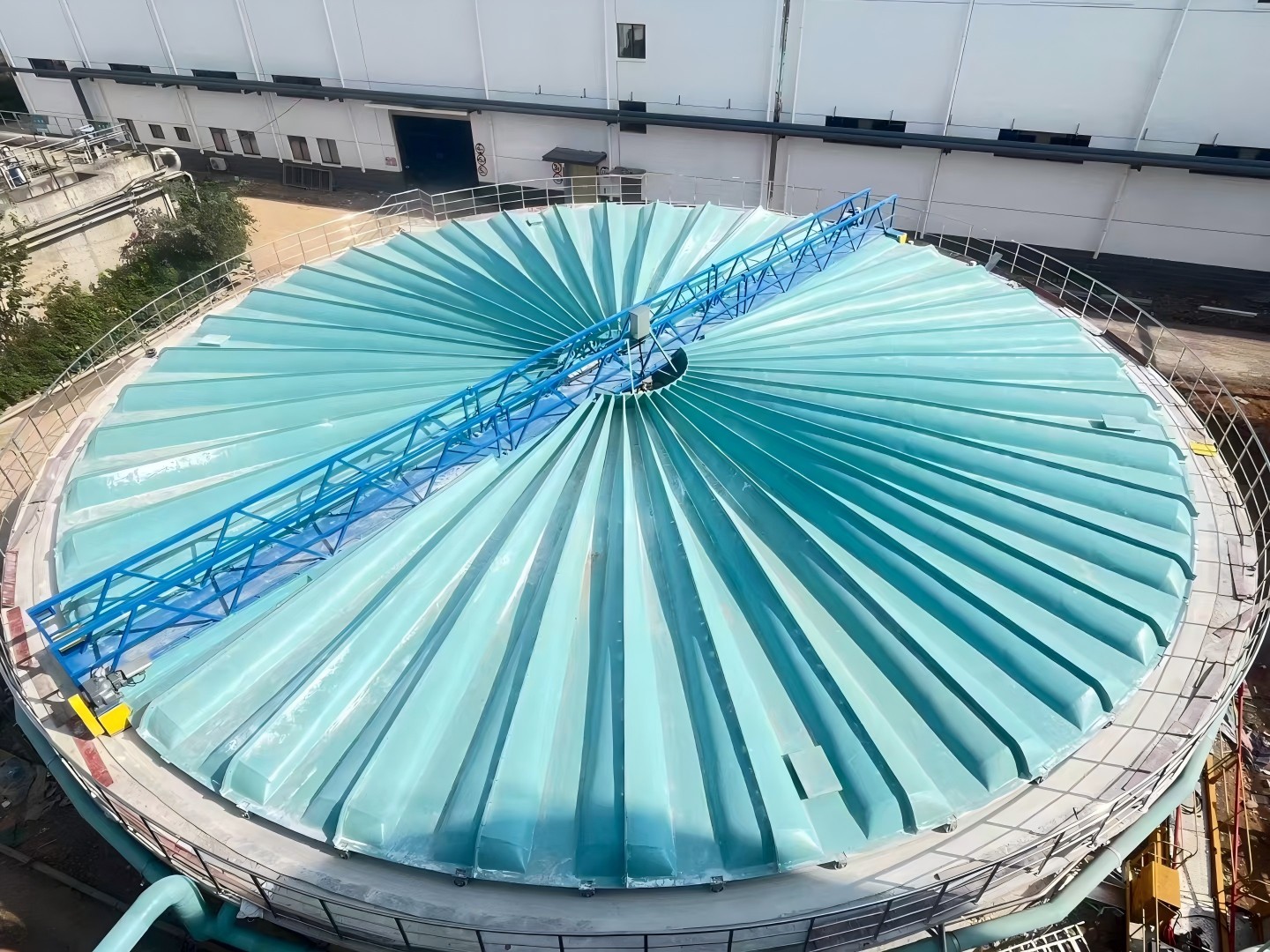 Rotating FRP covers installed on circular treatment tanks